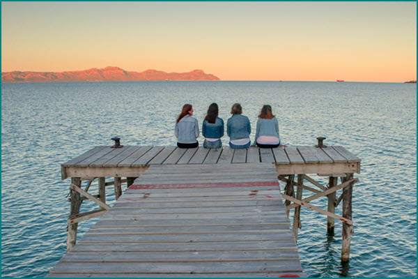 Four women on pier